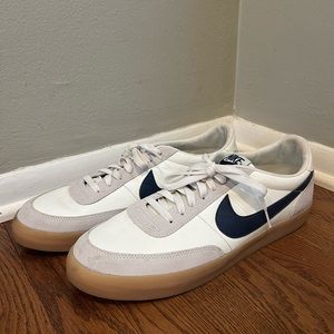 Men’s Nike low-top white sneakers with navy blue swoosh, size 13